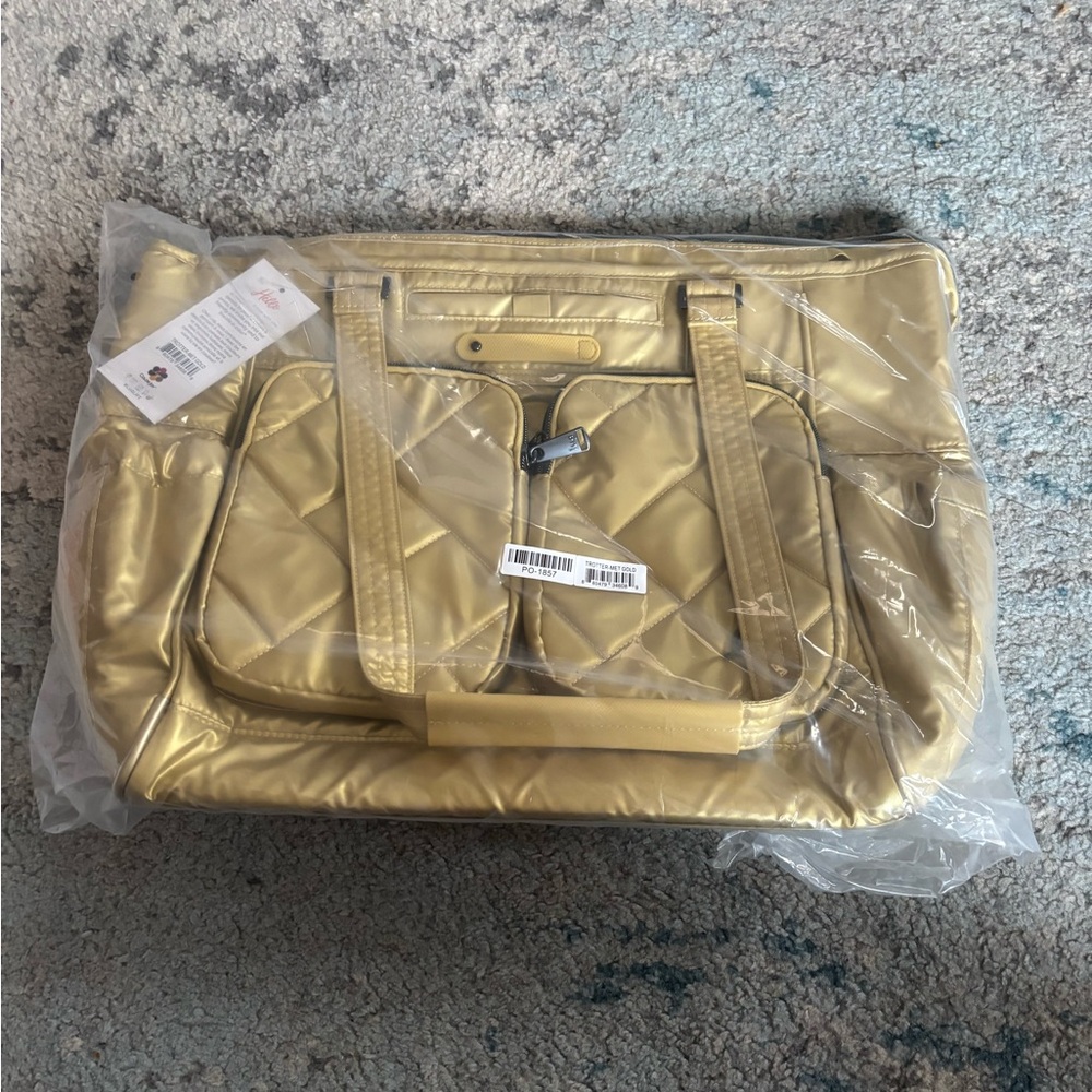NWT Lug Trotter tote bag in Metallic Gold